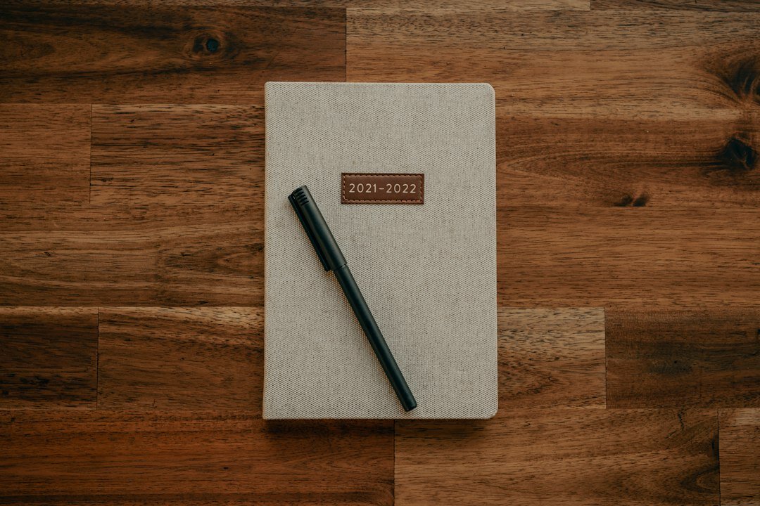 writer at desk with notebook