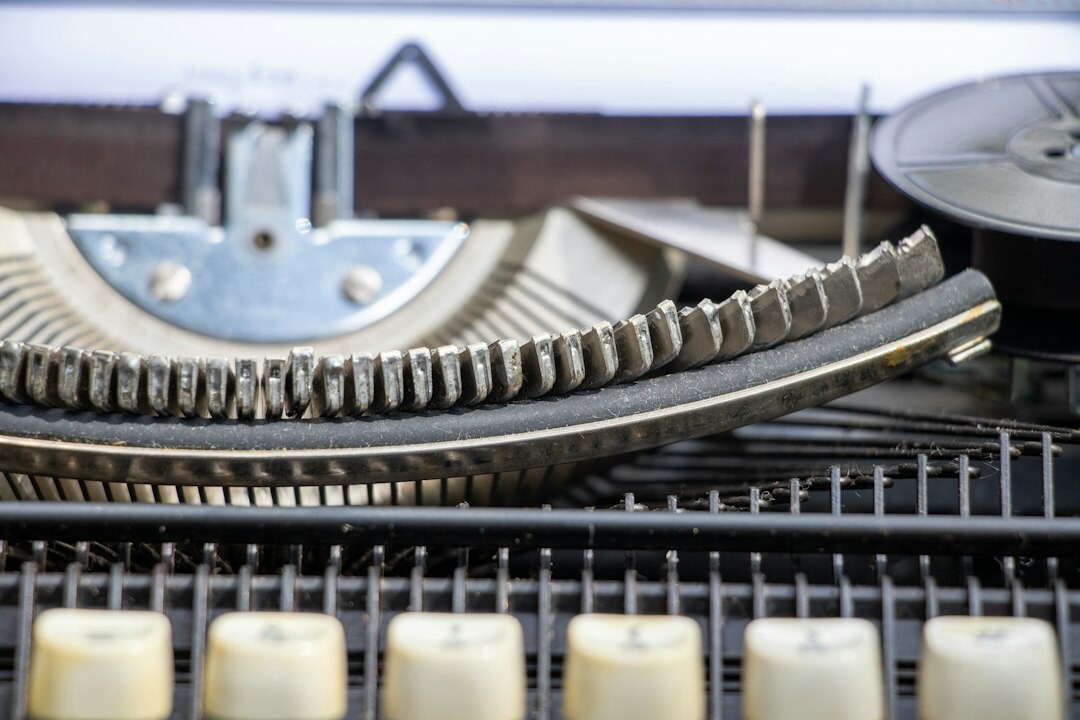 Close-up of vintage typewriter keys with paper loaded
